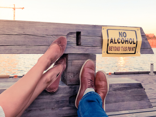no alcohol sign on a bench at a sober living
