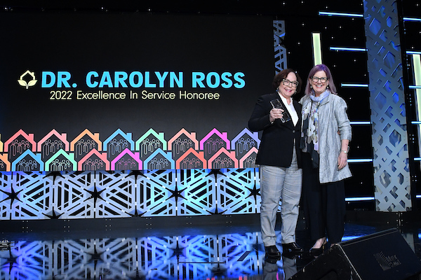 Carolyn-Ross-stage-award-and-Ericha-Scott